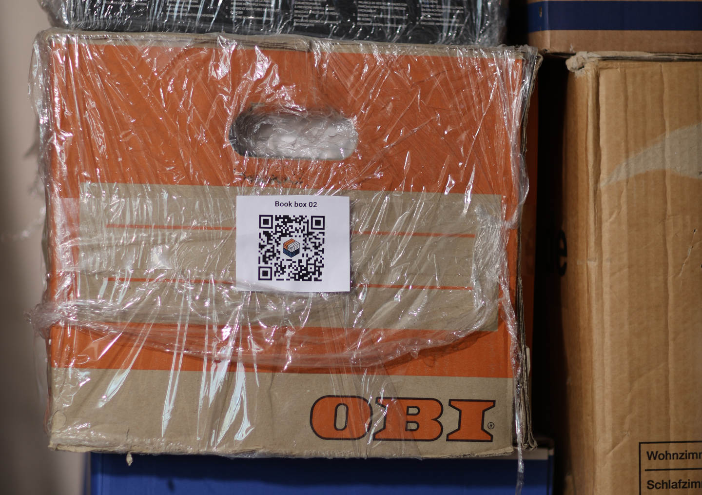 Close-up of a QR label attached to a real storage box